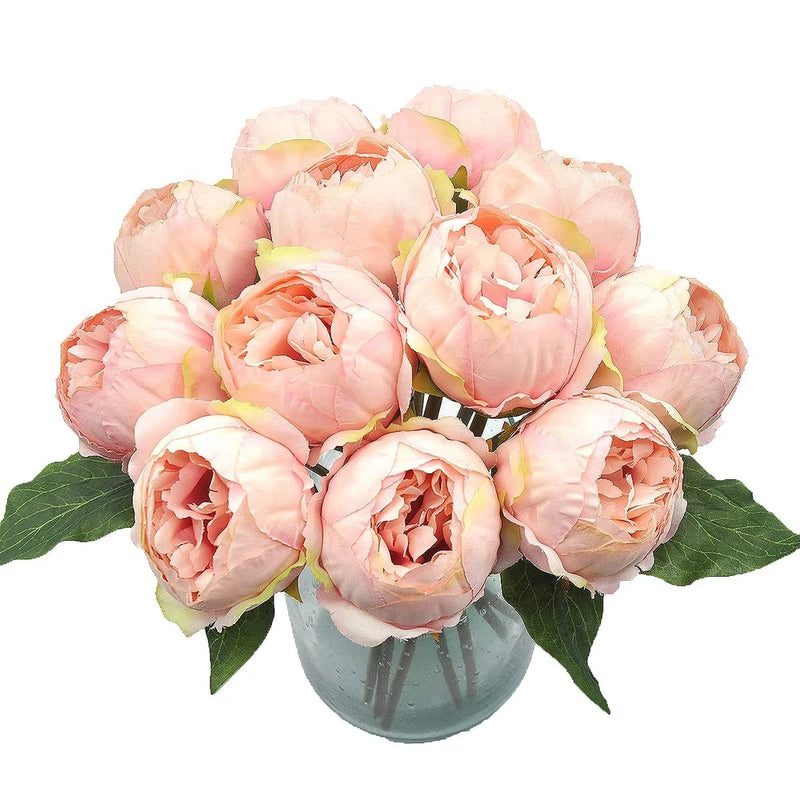 Set of 12 artificial pink peony heads with green leaves in a vase