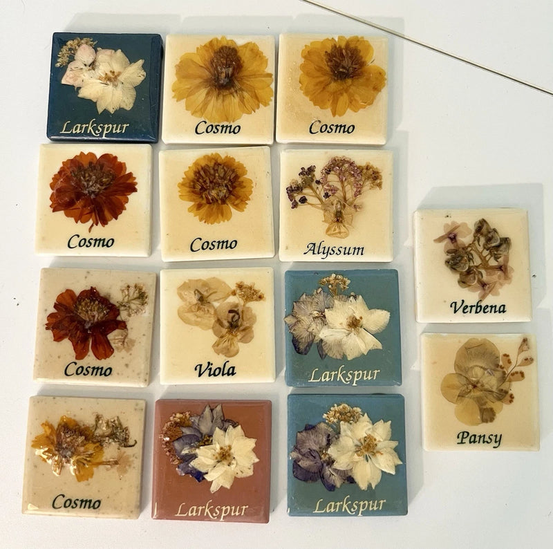 Set of 14 mini ceramic tiles with dried pressed flowers in varied colors