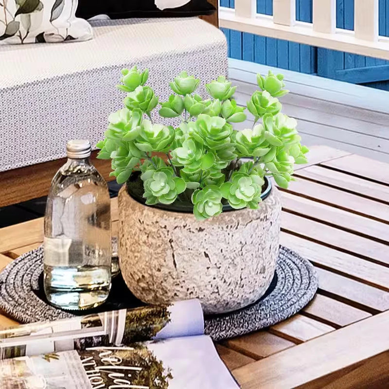 Artificial succulent stem plant with frosted light green rosette leaves in concrete pot