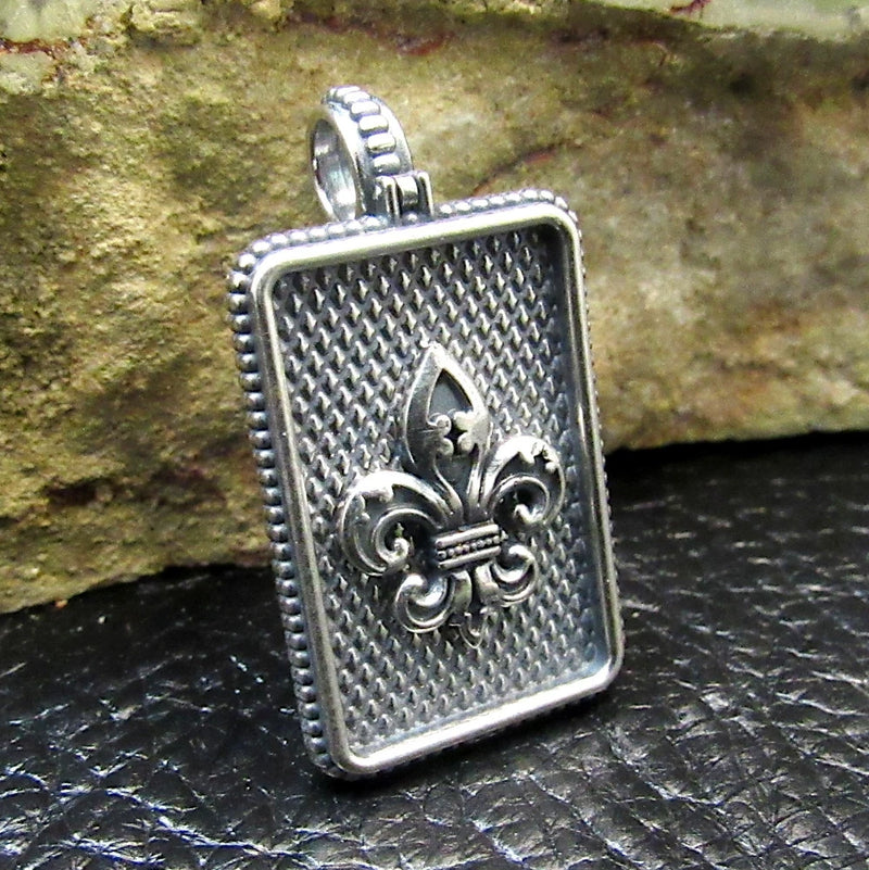 Sterling silver rectangle pendant with textured back and fleur-de-lis lily motif