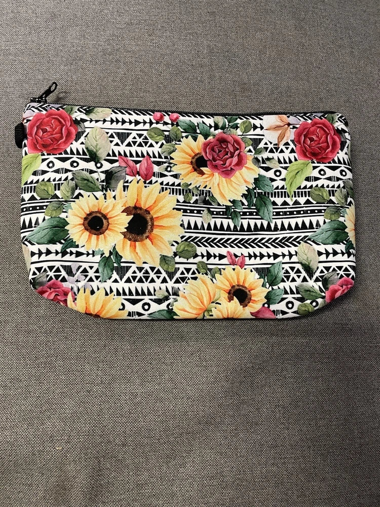 Floral cosmetic pouch with sunflowers, roses, and geometric stripes, zippered top