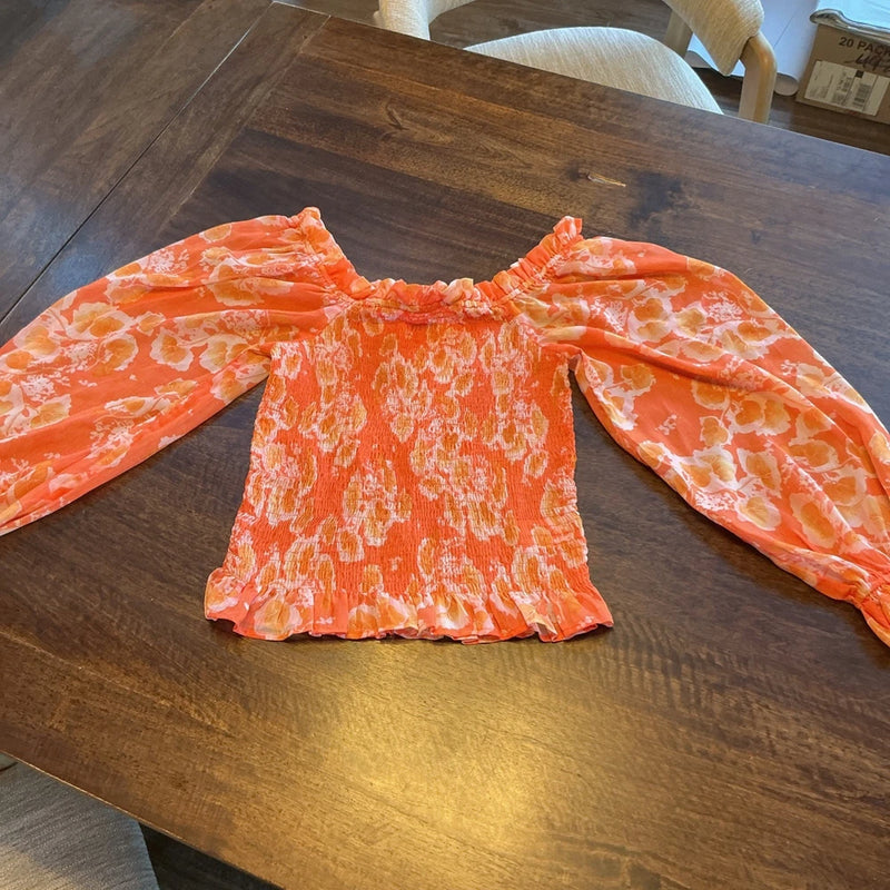 Orange floral ruffle blouse with gathered neckline and long flared sleeves