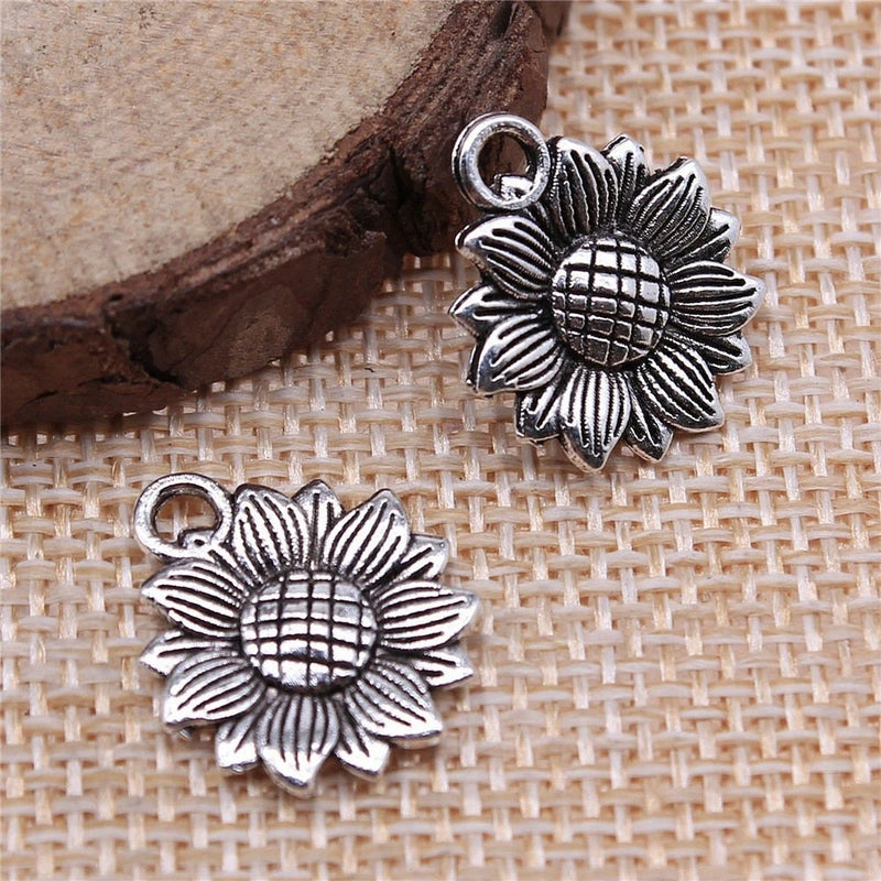 Antique silver sunflower charm pendant with top loop, two flower charms shown
