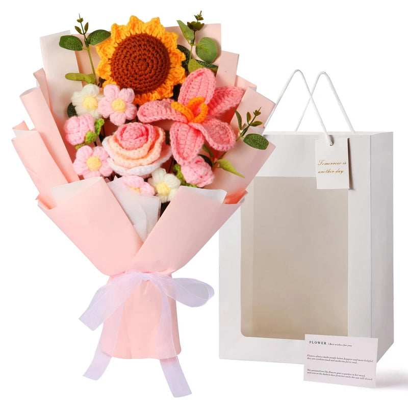 Handmade crochet flower bouquet with orange sunflower, pink blooms, green leaves and wrap ribbon