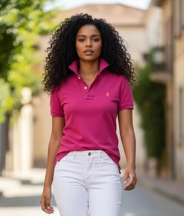 Women’s pink polo shirt with button placket and small chest logo