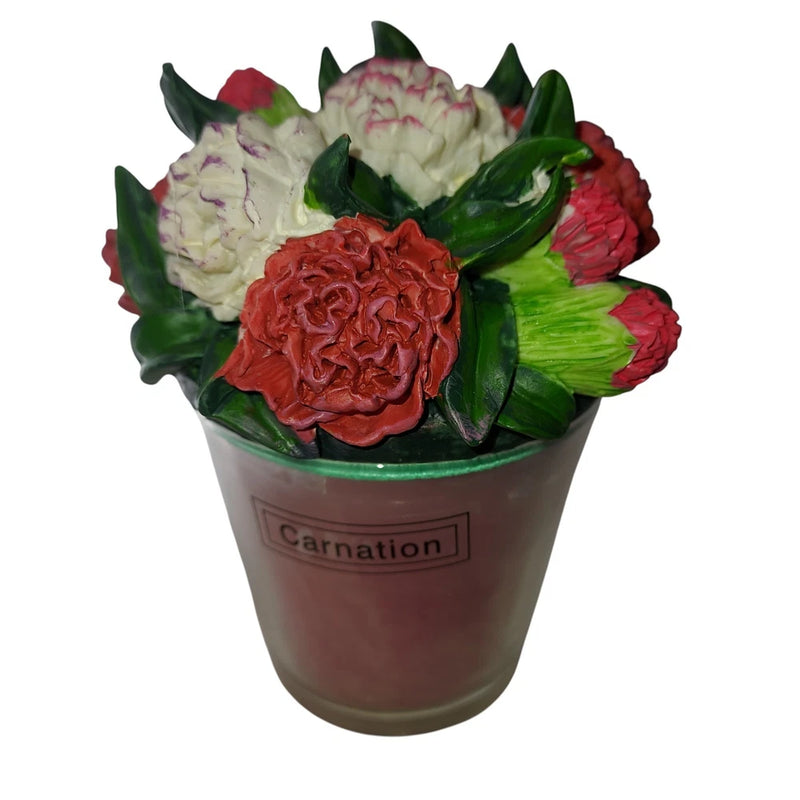 Ceramic votive candle holder with red carnation floral top and green leaves