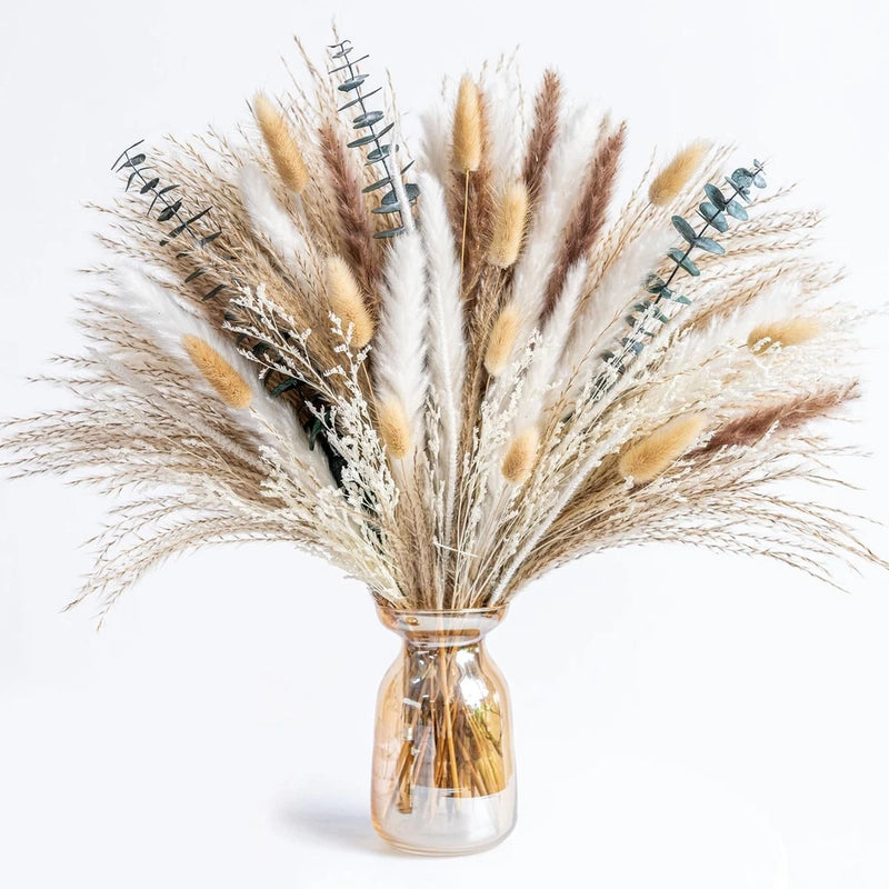 Boho dried pampas grass and eucalyptus bouquet in clear glass vase