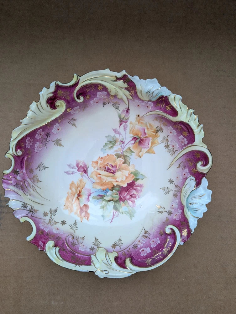 Antique decorative porcelain bowl with magenta floral rim and rose bouquet center