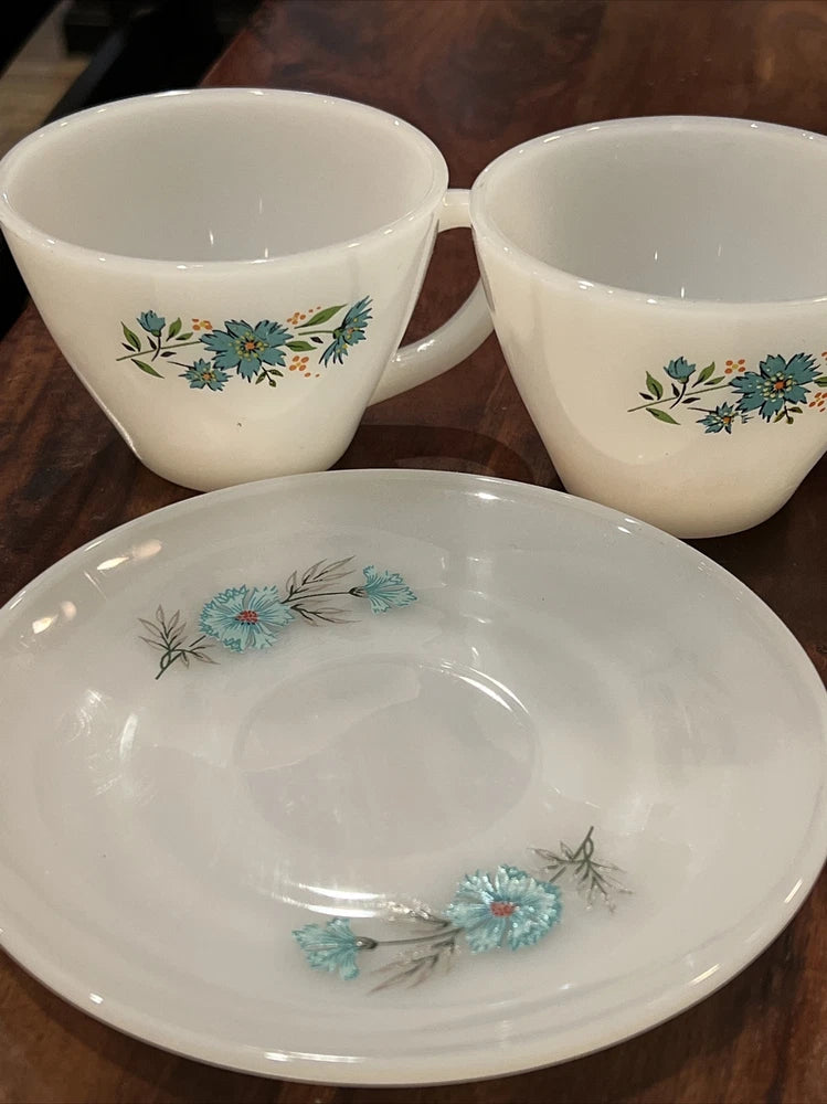Vintage coffee cup set with blue floral pattern, two cups and saucer
