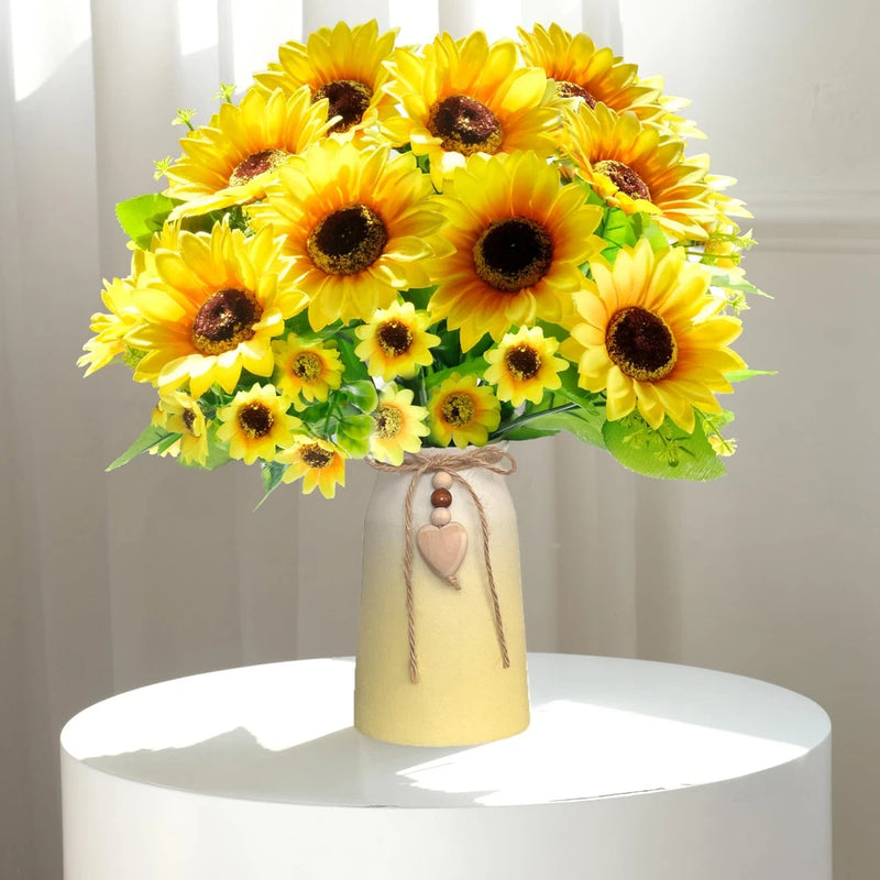 Artificial sunflower arrangement in white ceramic vase with pink charm, yellow silk blooms