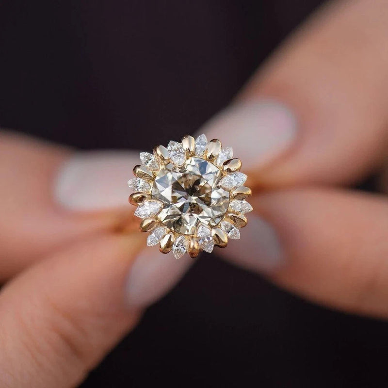 Moissanite halo wedding ring with round center and sunflower-style diamond accents