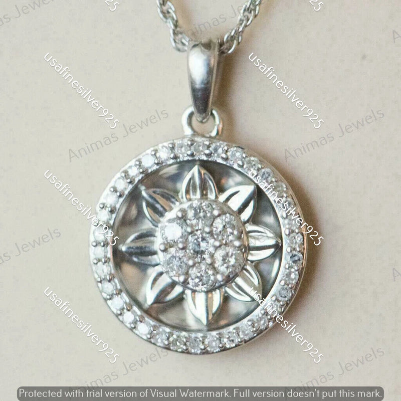 Round sunflower charm pendant with clear center stones and white jeweled halo in white gold