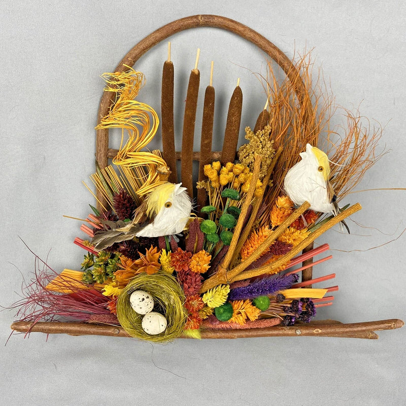 Dried flower bird wall wreath with twig ring, candles, and small feather birds