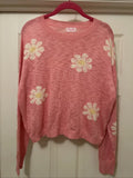 Pink Lily women's knit sweater with pink base and light yellow flower patterns