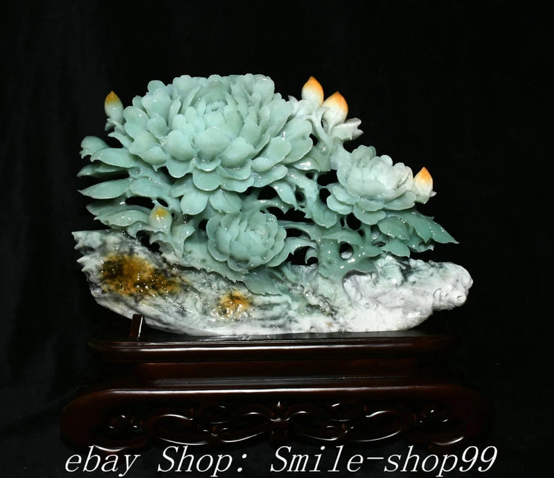 Carved pale green jade peony flower tree sculpture on dark wooden base