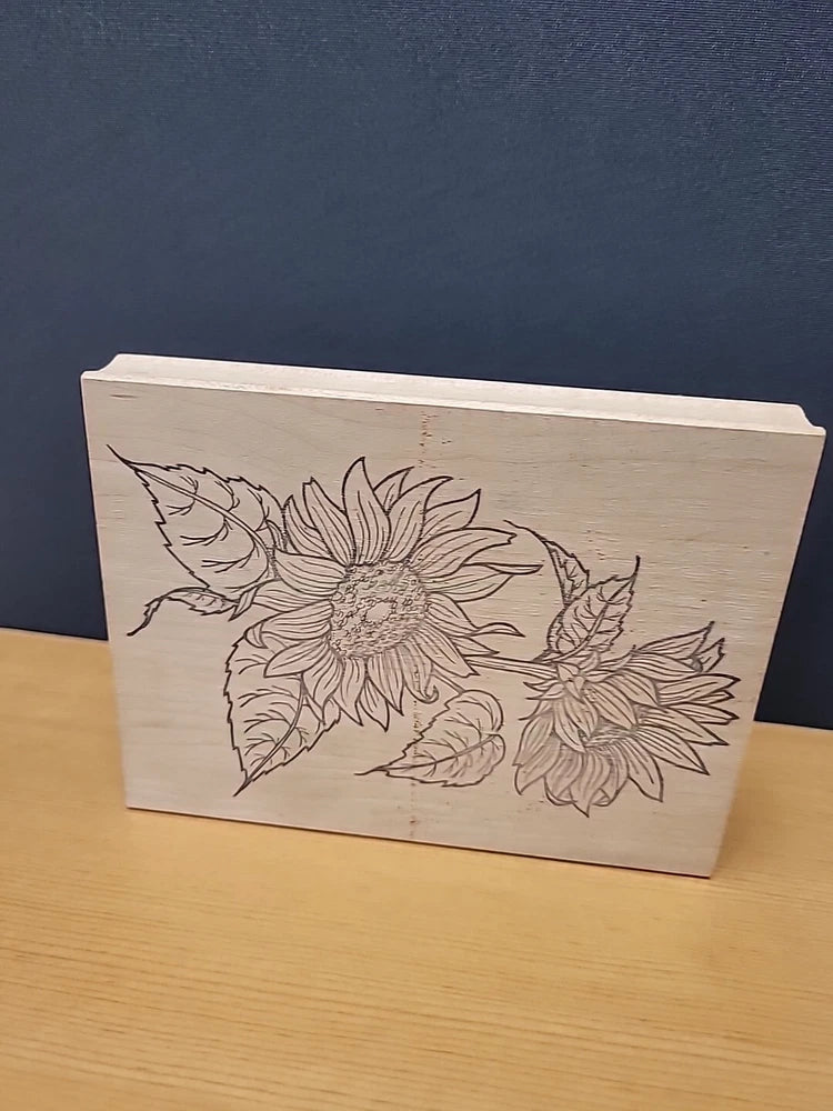 Sunflower rubber stamp with floral line-art design on wooden block