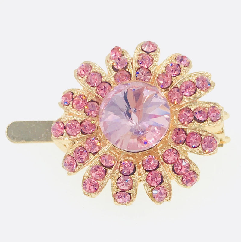 Pink rhinestone flower hair clip with large round crystal center on gold-tone pin