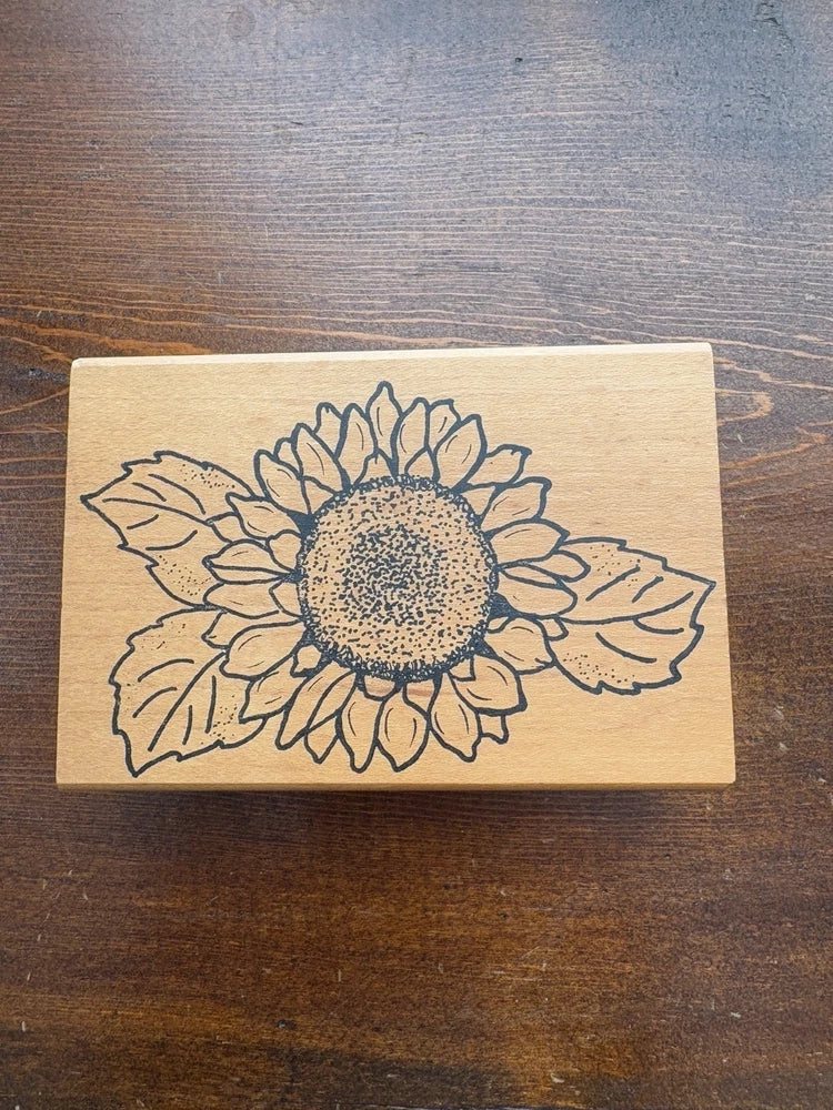 Mounted sunflower rubber stamp with line-art flower on rectangular wood block