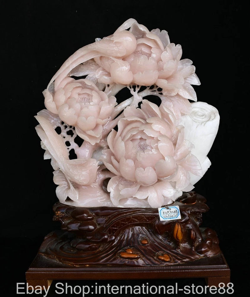 Pink jade-style peony flower and bird carving statue on dark wooden base