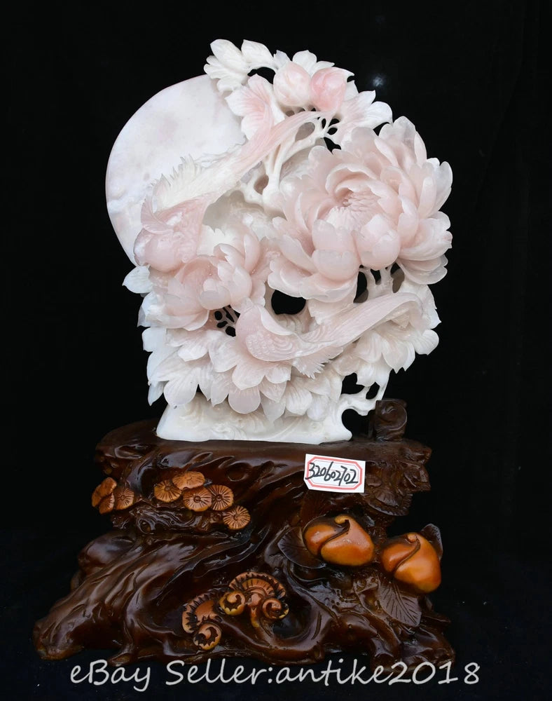 Carved peony and bird ornament statue with white and pink floral detail on dark base