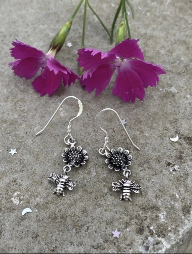Silver sunflower and bee dangle earrings with hook closures and small dangling charms