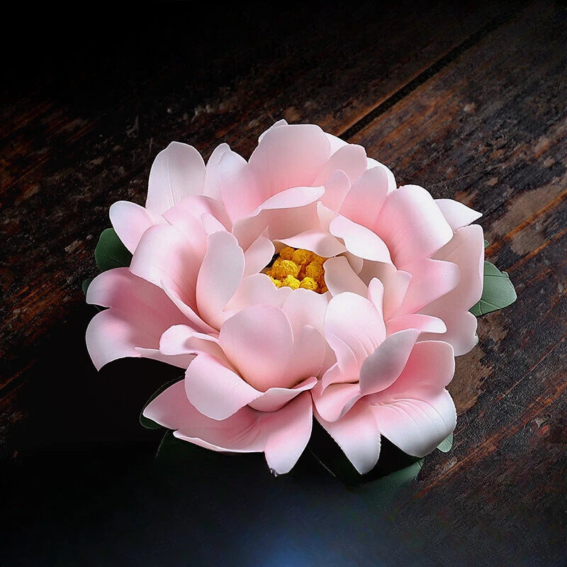 Handmade porcelain peony flower ornament with pink layered petals and yellow center