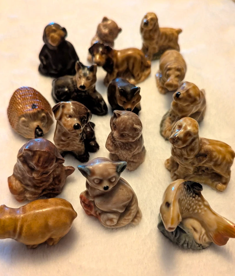 Assorted ceramic animal figurines, brown and black with blue eyes