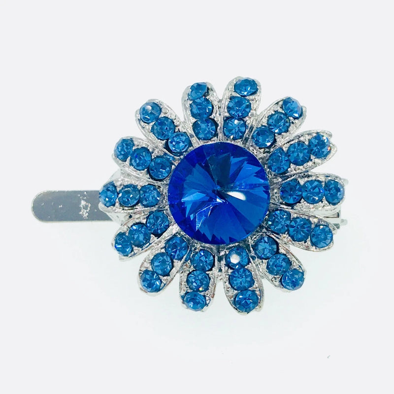 Blue rhinestone sunflower hair clip with faceted crystal center and petal detailing