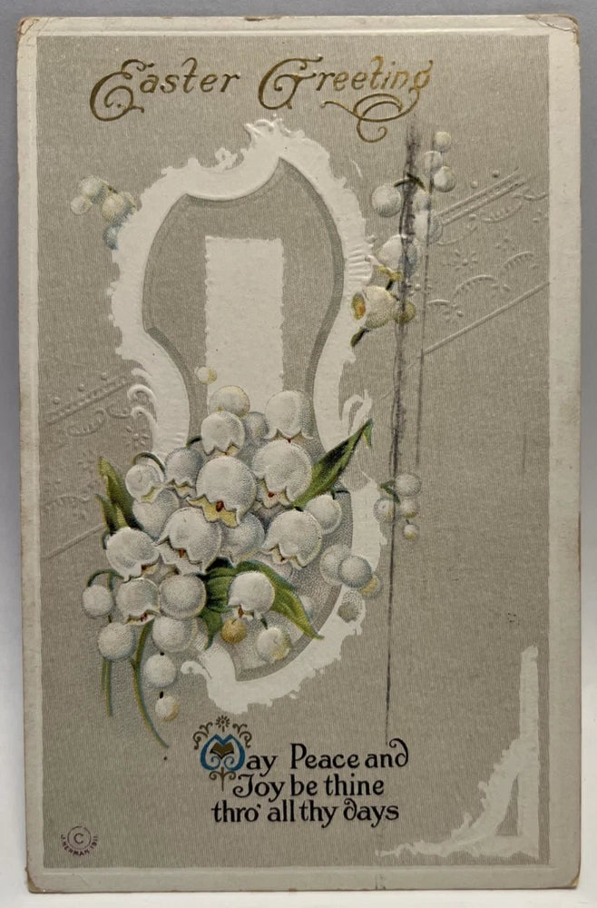 Vintage embossed Easter greeting postcard with lily of the valley flowers and ornate frame.