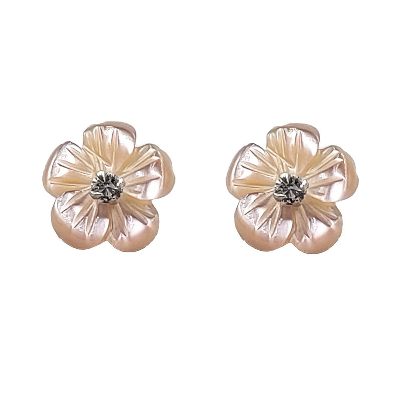 Silver flower stud earrings with gold-tone petals and a rhinestone center
