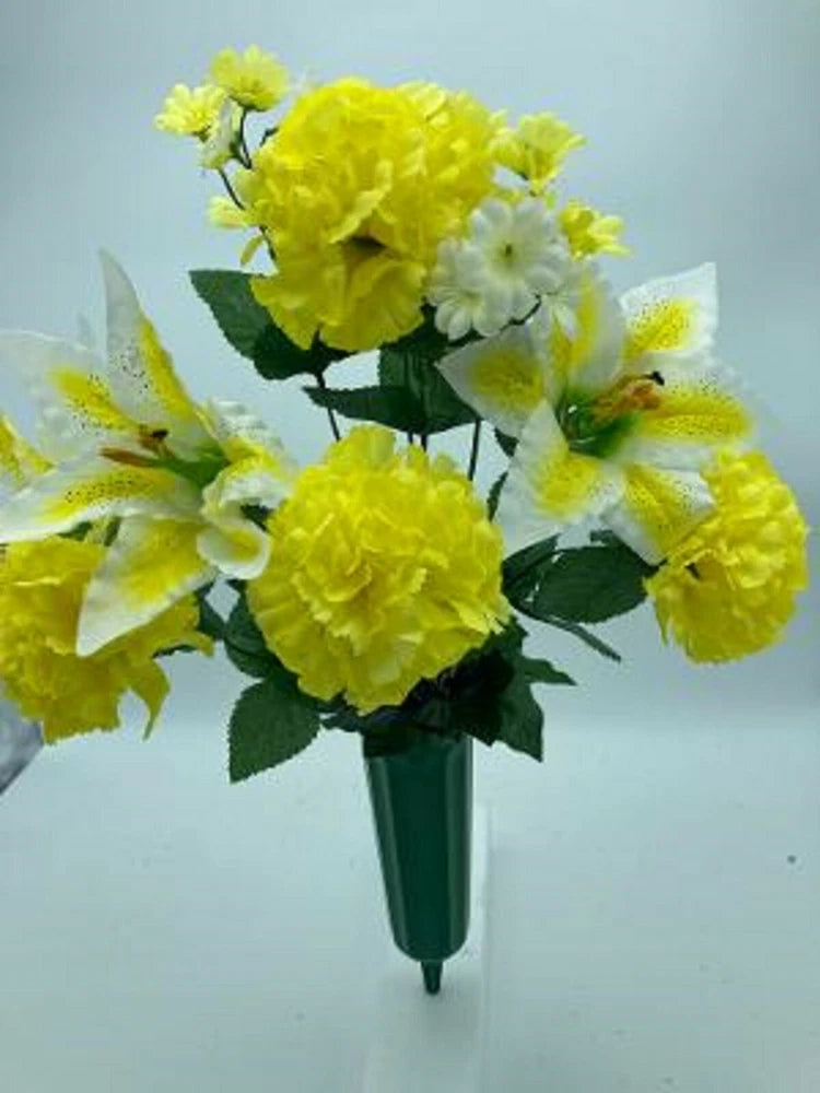 Yellow and white silk flower bouquet with carnations, lilies, and green leaves