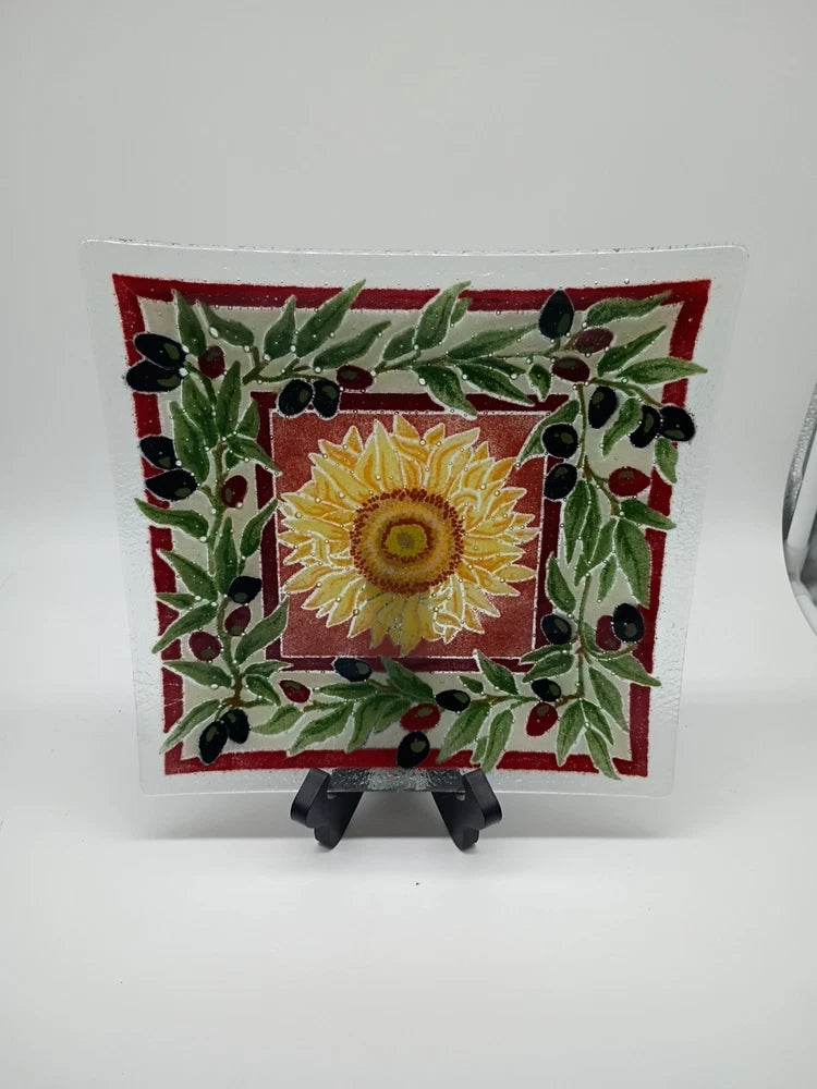 Square fused glass plate with yellow sunflower, red border, green leaves, black olives