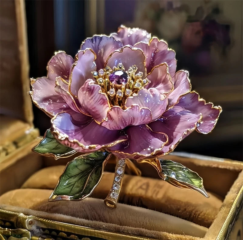 Purple and pink peony flower brooch with rhinestone accents and gold-tone leaves