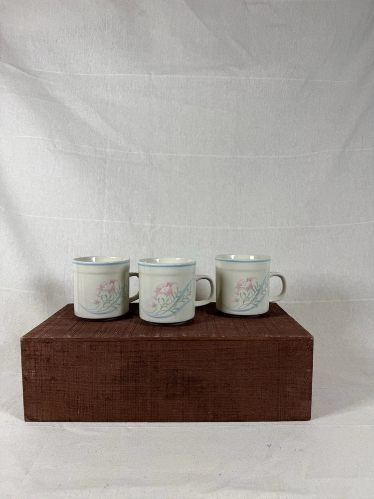 Floral stoneware coffee mugs, white with green and pink floral design, two handles