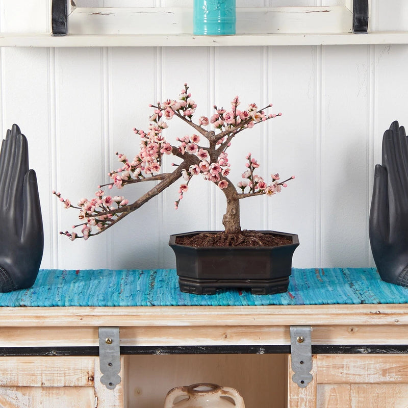 Artificial cherry blossom bonsai tree with pink blossoms and decorative dark planter