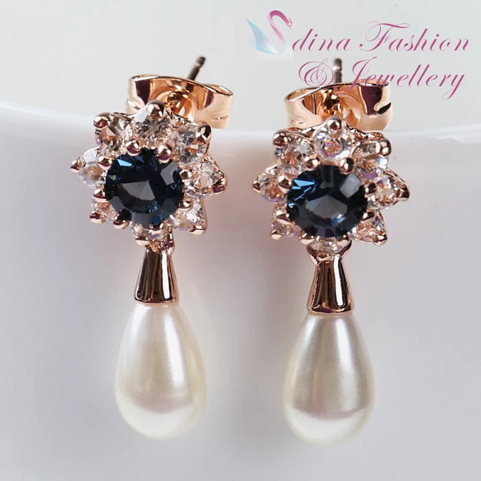 Rose gold sunflower crystal drop earrings with black center and teardrop pearls