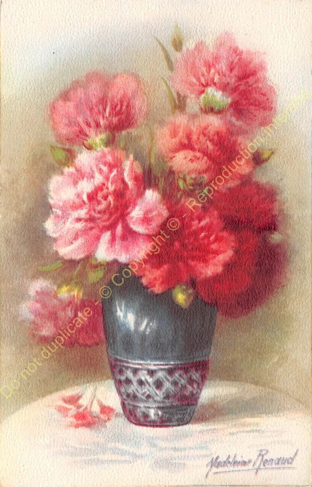 Carnation flower bouquet in ceramic vase with pink and red blooms