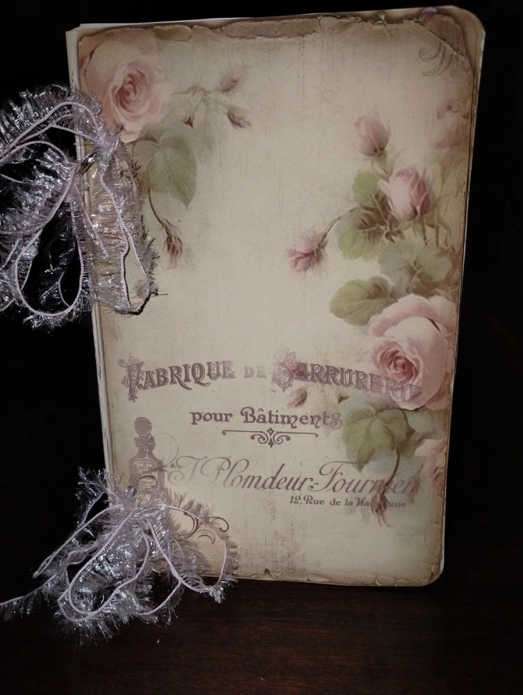 Vintage rose-floral junk journal scrapbook with decorative ribbon on fabric cover
