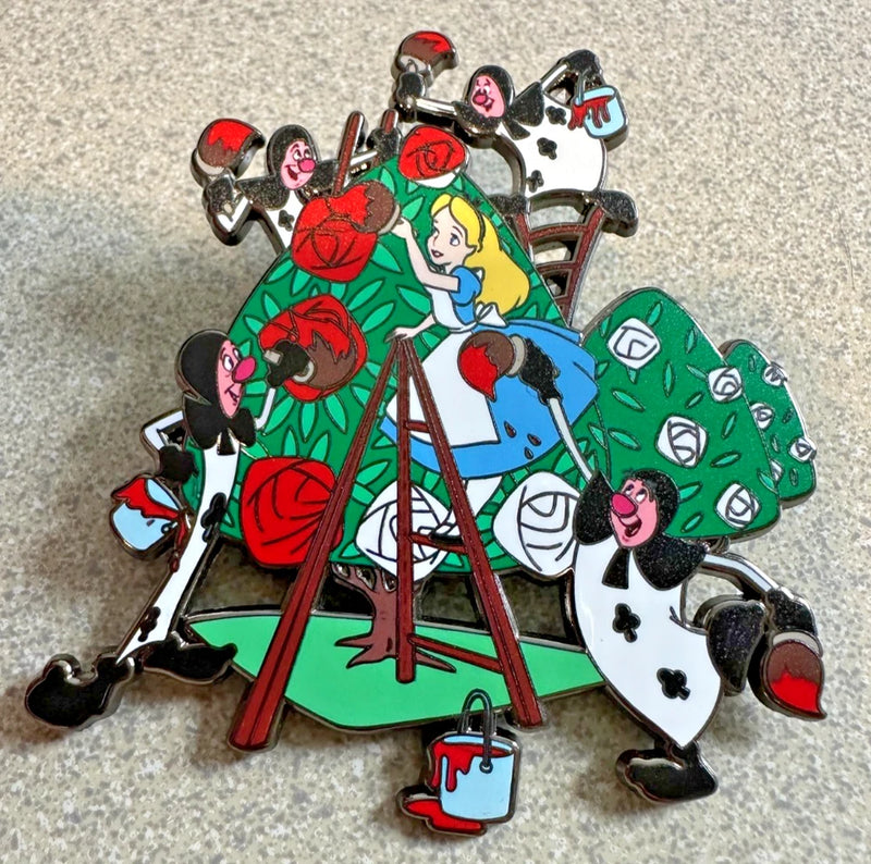 Jumbo fantasy enamel pin with Alice holding roses and playing cards, red and green details