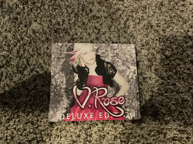 V. Rose deluxe edition CD cover with woman portrait and pink logo