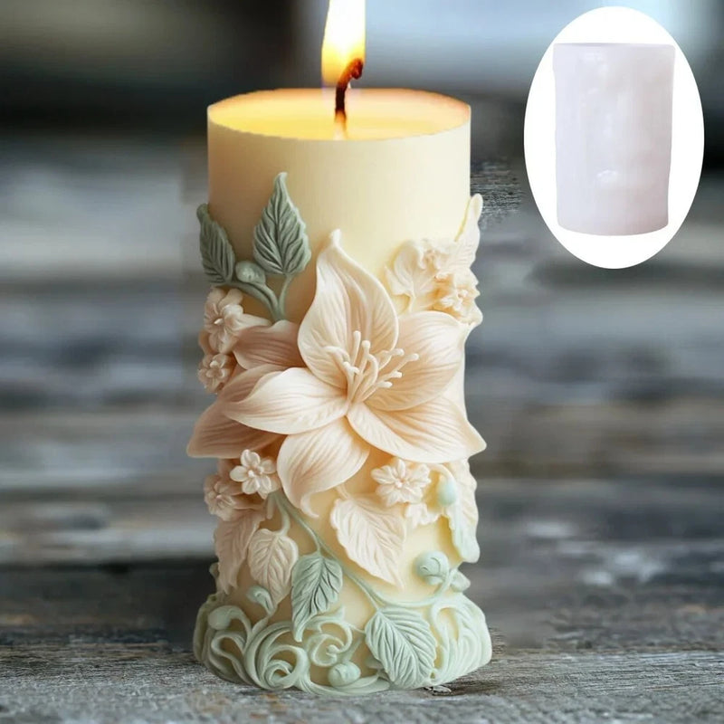 Cream cylinder candle with embossed peony and leaf floral design on the front