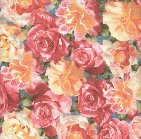 Floral quilt fabric with pink, red, and cream roses and blossoms