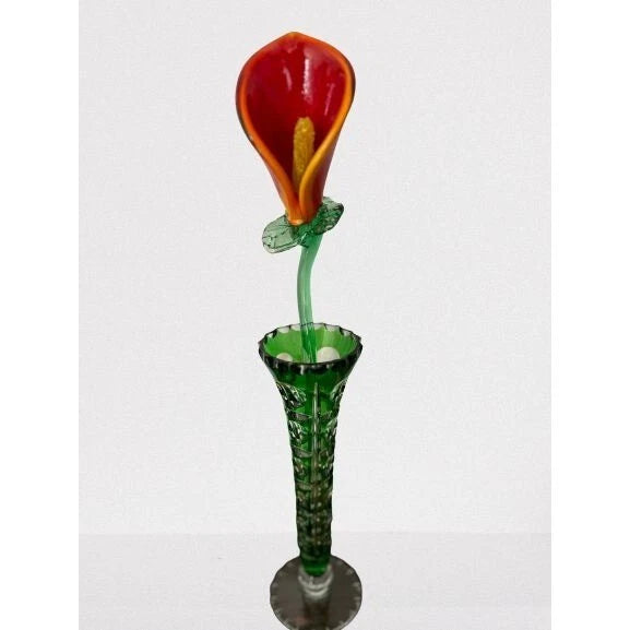 Handmade art glass calla lily sculpture with red flower, green stem, and round base.