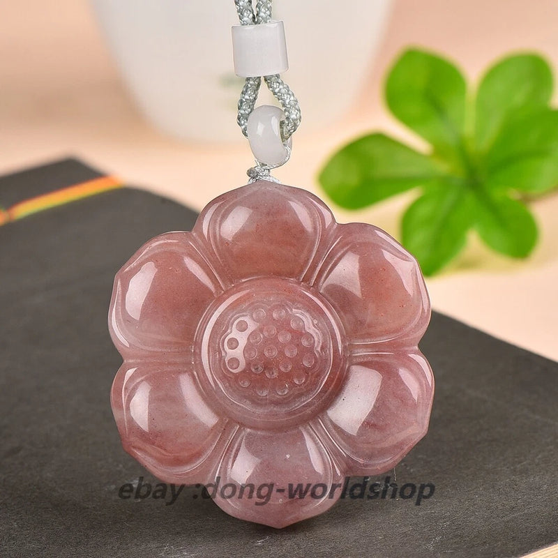 Carved pink jade peony flower pendant with round carved center and silver-tone loop