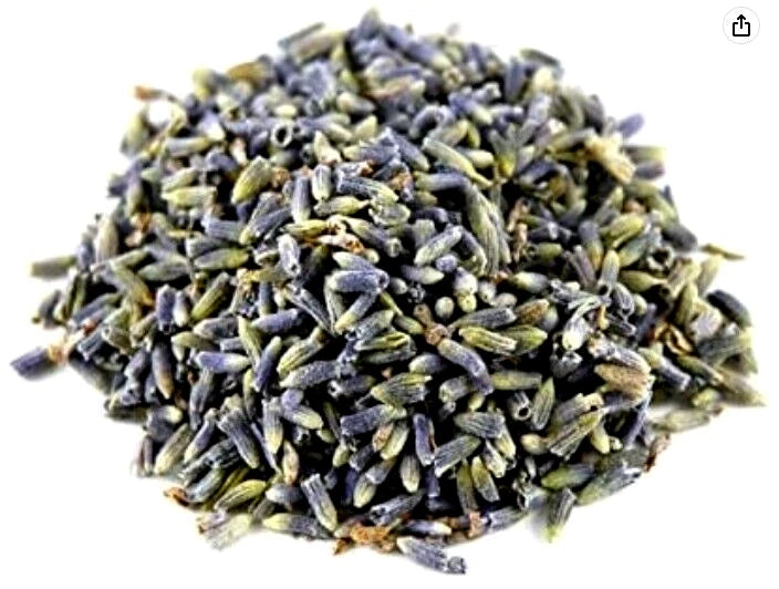 Dried lavender flower buds, small purple buds with green stems in a heap