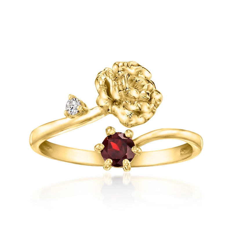 Gold-tone flower ring with red oval gemstone, small diamond accents, and raised textured bloom