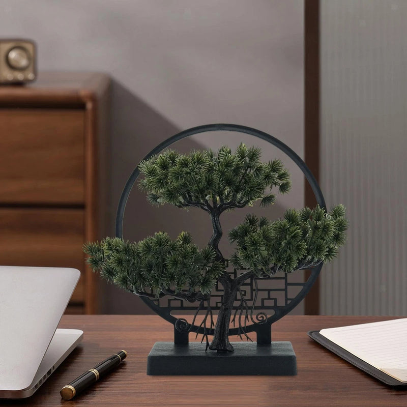 Artificial bonsai tree with dense green foliage on a dark rectangular base.