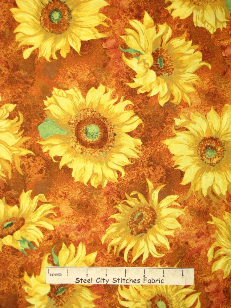 Sunflower floral fabric with yellow and orange blooms on warm brown background
