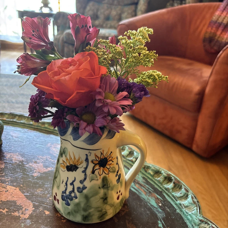 Painted pottery pitcher vase with sunflower motif, wide handle, floral decorations