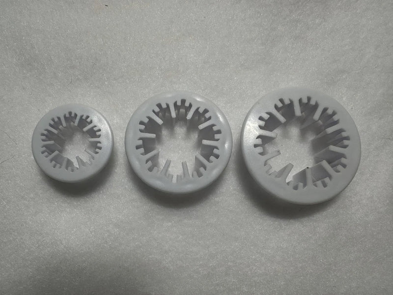 Set of 3 circular flower cutters with petal-textured cutting edges, gray